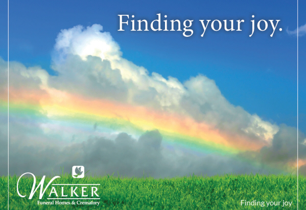 A rainbow stretches over a bright green field against a blue sky with clouds. The Walker Funeral Homes & Crematory logo.